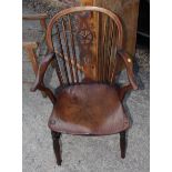 An oak provincial country armchair with rush seat and an oak and elm Windsor wheelback armchair