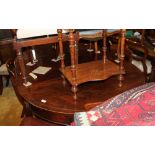 A Georgian two-section circular mahogany dining table with centre leaf, on square tapered castored