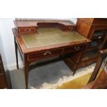 An Edwardian Sheraton design satinwood banded mahogany writing table, low back fitted two small