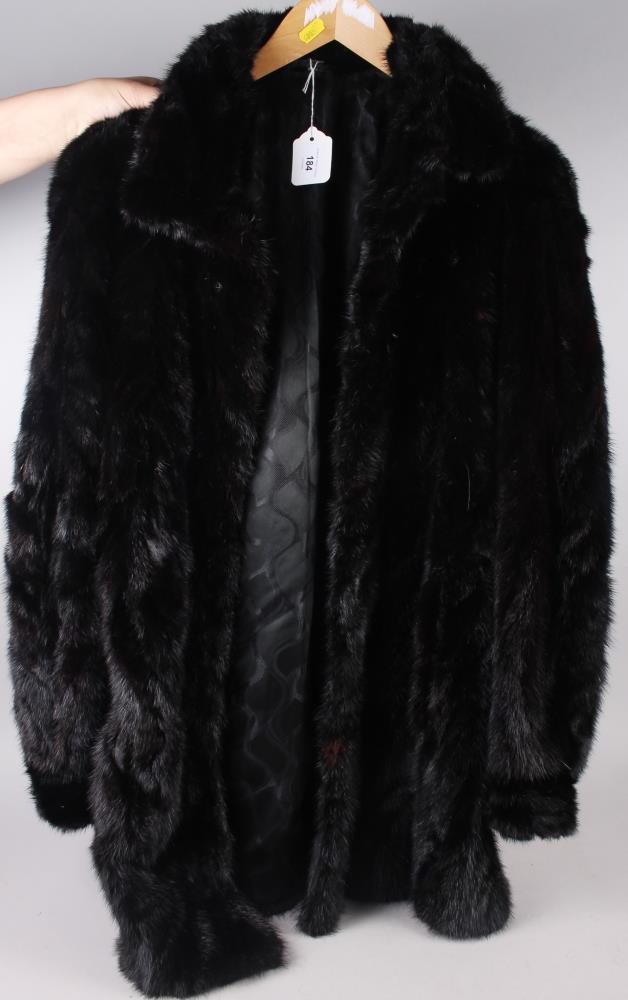 A black mink three-quarter length jacket, size 12