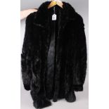 A black mink three-quarter length jacket, size 12