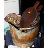 A copper helmet coal scuttle, a pair of wooden bellows, a copper Art Nouveau crumb scoop and a