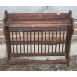 A white Lloyd Loom linen basket, a music stand, a plate rack and a towel rail