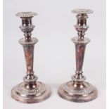 A pair of Georgian design silver plated candlesticks with gadroon borders, 10" high, and an oval