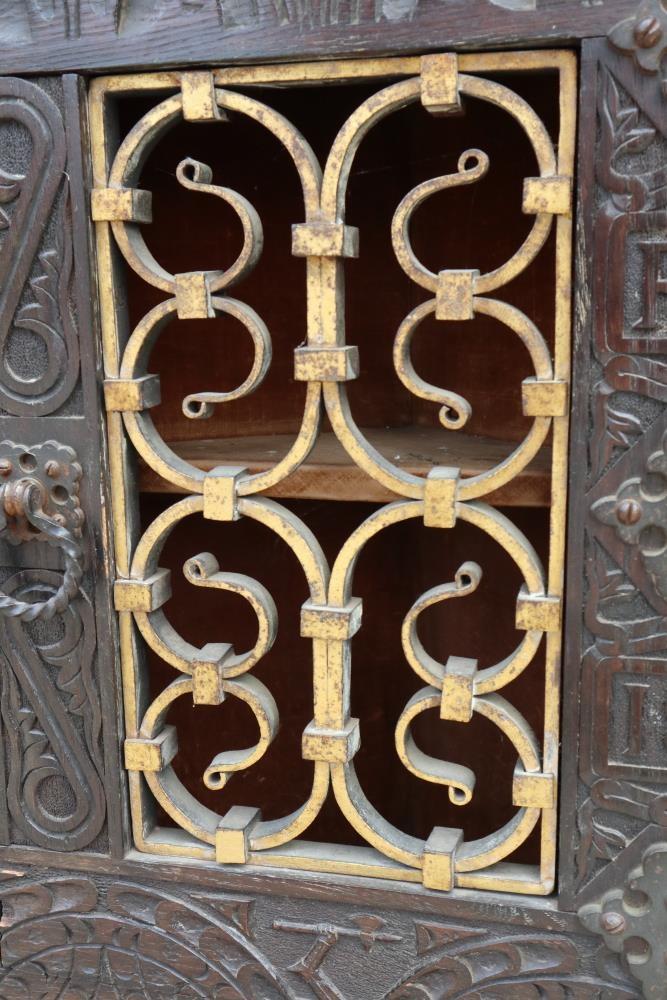 A 19th century carved oak corner cupboard, inscribed RTP 1883, with wrought iron grille door, 20" - Image 2 of 3