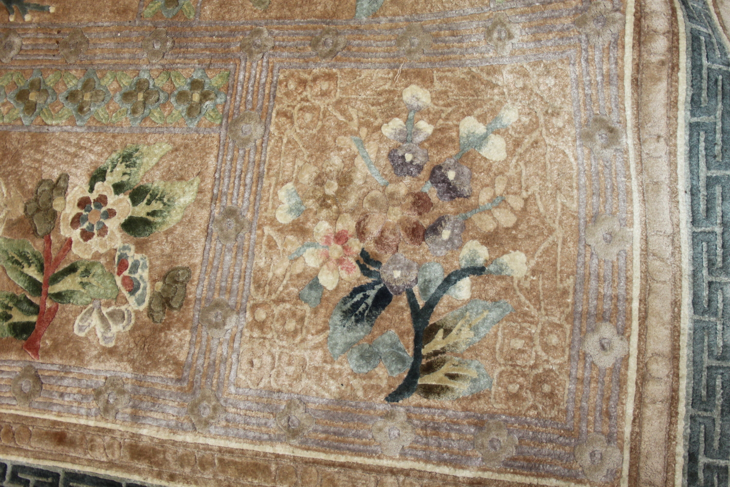 A Chinese silk carpet decorated thirteen floral panels on a beige ground and main floral border - Image 2 of 7