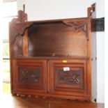 A late Victorian walnut wall cabinet, fitted shelf and lower cupboard, 23" wide