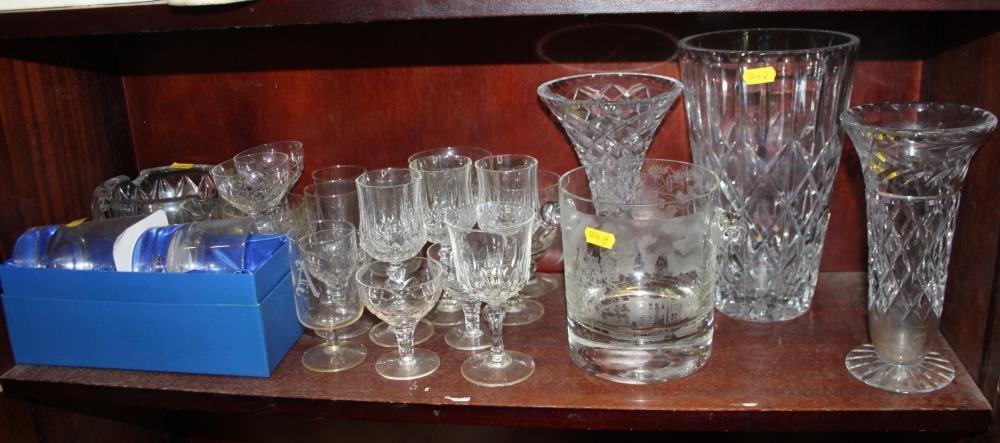 An etched glass ice bucket, vases, whisky tumblers, ashtrays and other glassware