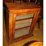 A Victorian inlaid walnut pedestal display cabinet with single glazed door, inlaid frieze and gilt