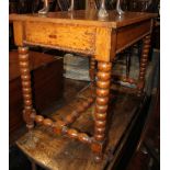 A 19th century oak side table, fitted frieze drawer, on bobbin turned supports, 36" wide