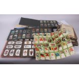 A collection of Players and Wills cigarette cards, loose, in albums and in slip covers, including