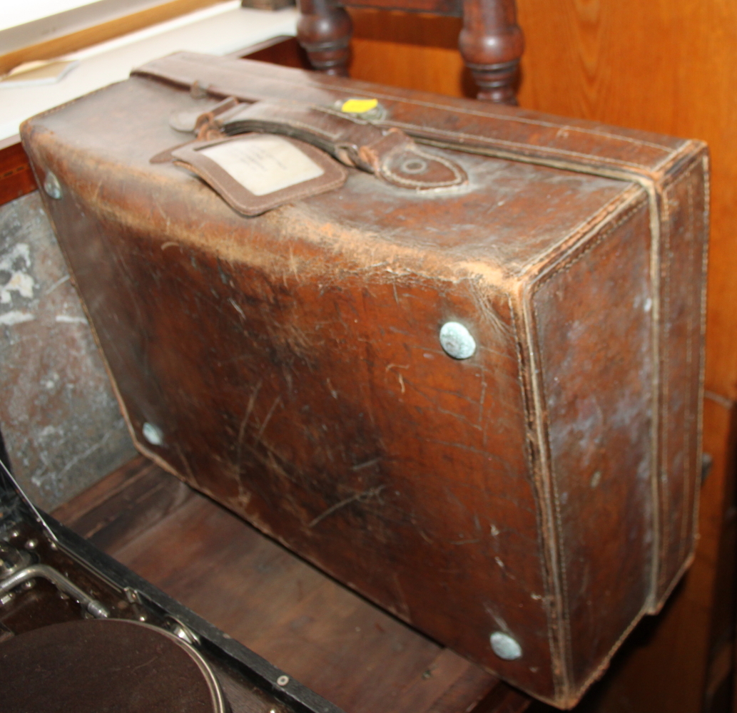 An HMV portable gramophone, in black case, and a brown leather suitcase - Image 2 of 2
