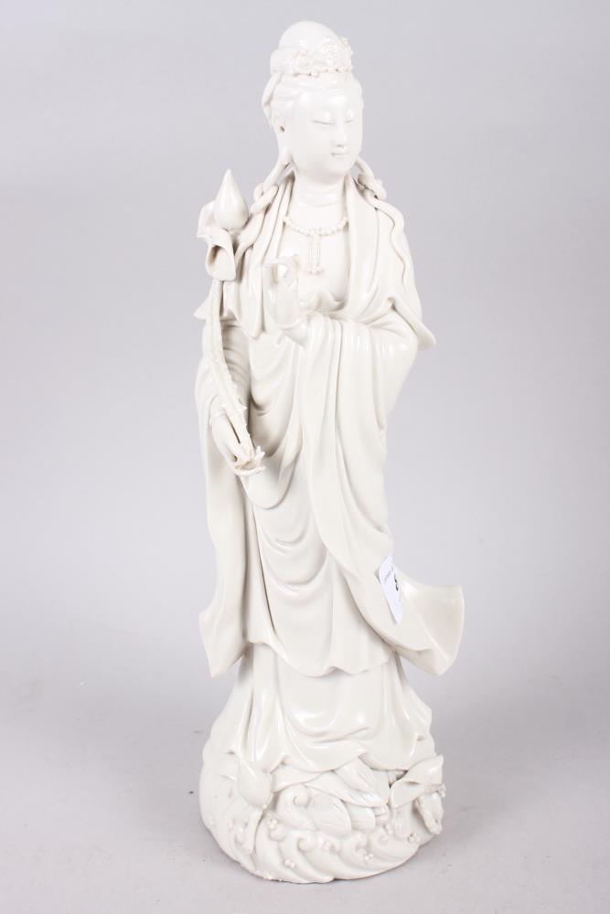 A 20th century blanc de chine figure of Kuan Yin, 11" high