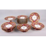 A 19th century French porcelain dessert service with floral and gilt decoration on a crimson ground