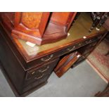 A Georgian design twin pedestal desk with green tooled leather top, 54" wide