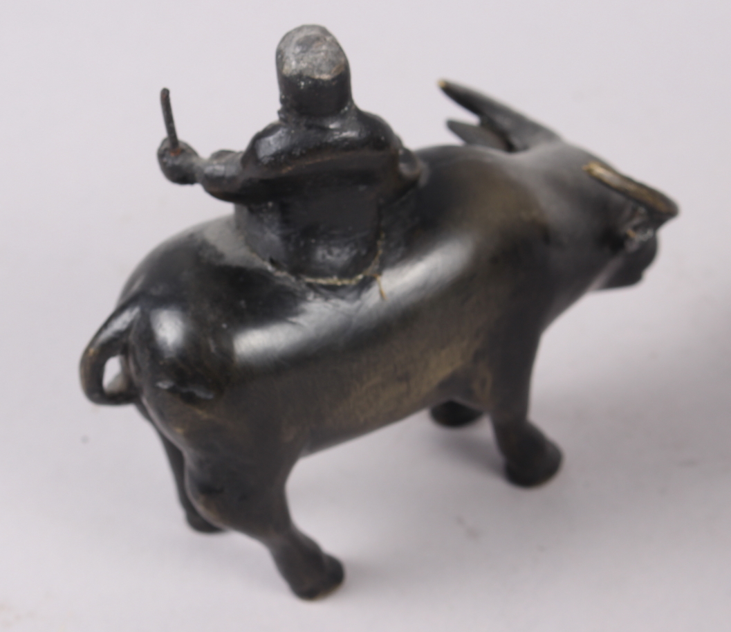 Two Chinese bronze models of figures on the back of buffalos, larger 6 1/4" high - Image 3 of 7