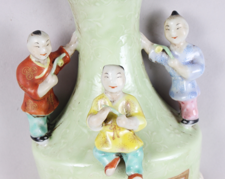 A Chinese polychrome decorated figure of a man holding a sword, a green glazed wall pocket with - Image 5 of 25