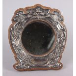 An Edwardian silver faced oak strut mirror, embossed "There's Rosemary That's for Remembrance", 6"