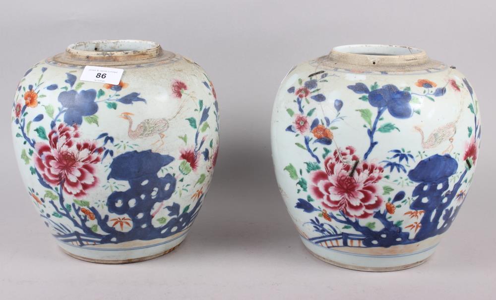A pair of 19th century porcelain ginger jars, decorated flowering bushes, 9" high (lacking covers)