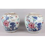 A pair of 19th century porcelain ginger jars, decorated flowering bushes, 9" high (lacking covers)