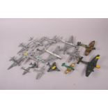 A Dinky Toys die-cast model Junkers plane, a Dinky Toys Spitfire MK II, a Dinky Toys Gloster