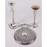 A silver hand mirror, a filled silver candlestick and a silver specimen vase with weighted base