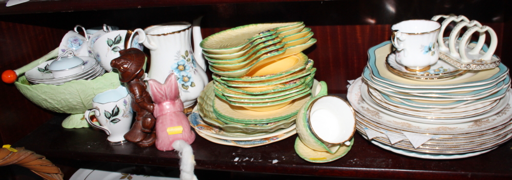 Two Clarice Cliff sandwich plates decorated stylised fish, a Carlton Ware triangular salad bowl