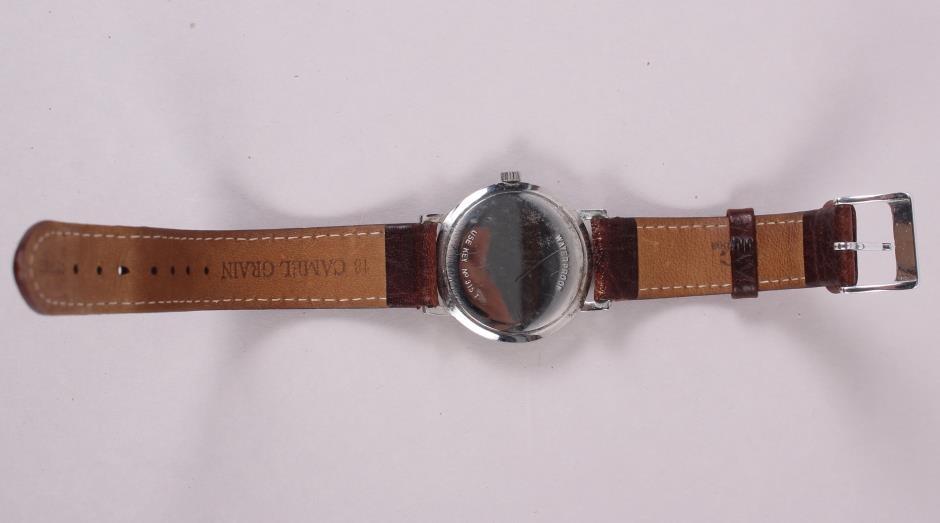 A stainless steel cased Tissot wristwatch with silvered dial and Arabic numerals, on leather strap - Image 4 of 4