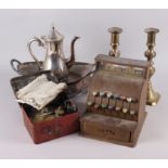 A tin-plate toy cash register, a brass primus stove, in tin, a pair of brass candlesticks and