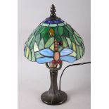A Tiffany style table lamp with coloured glass panels, decorated dragonflies, 13 1/4" high