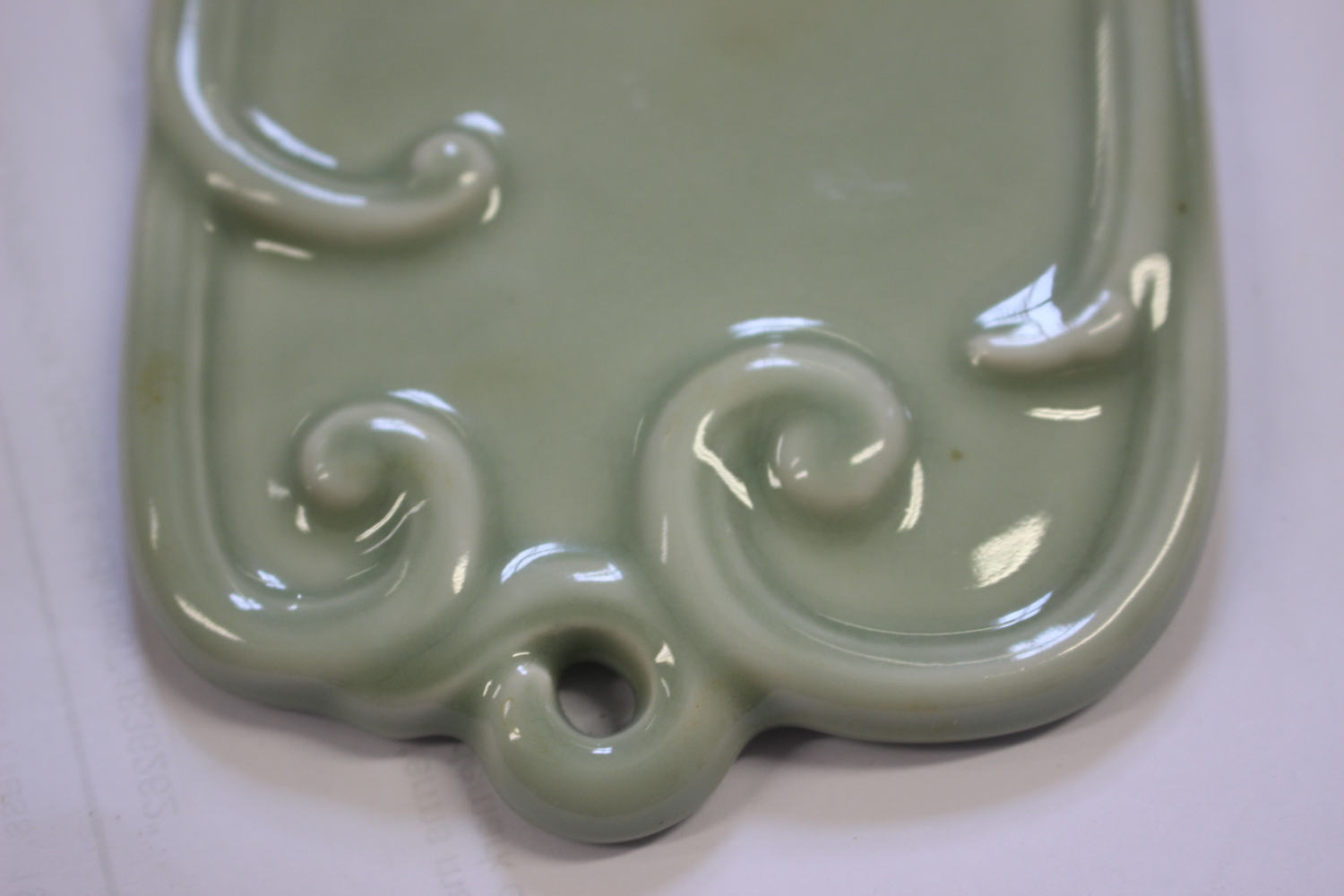 Three Chinese porcelain tea bowls, a turned hardstone tea bowl and a celadon glazed wall plaque, - Image 10 of 13