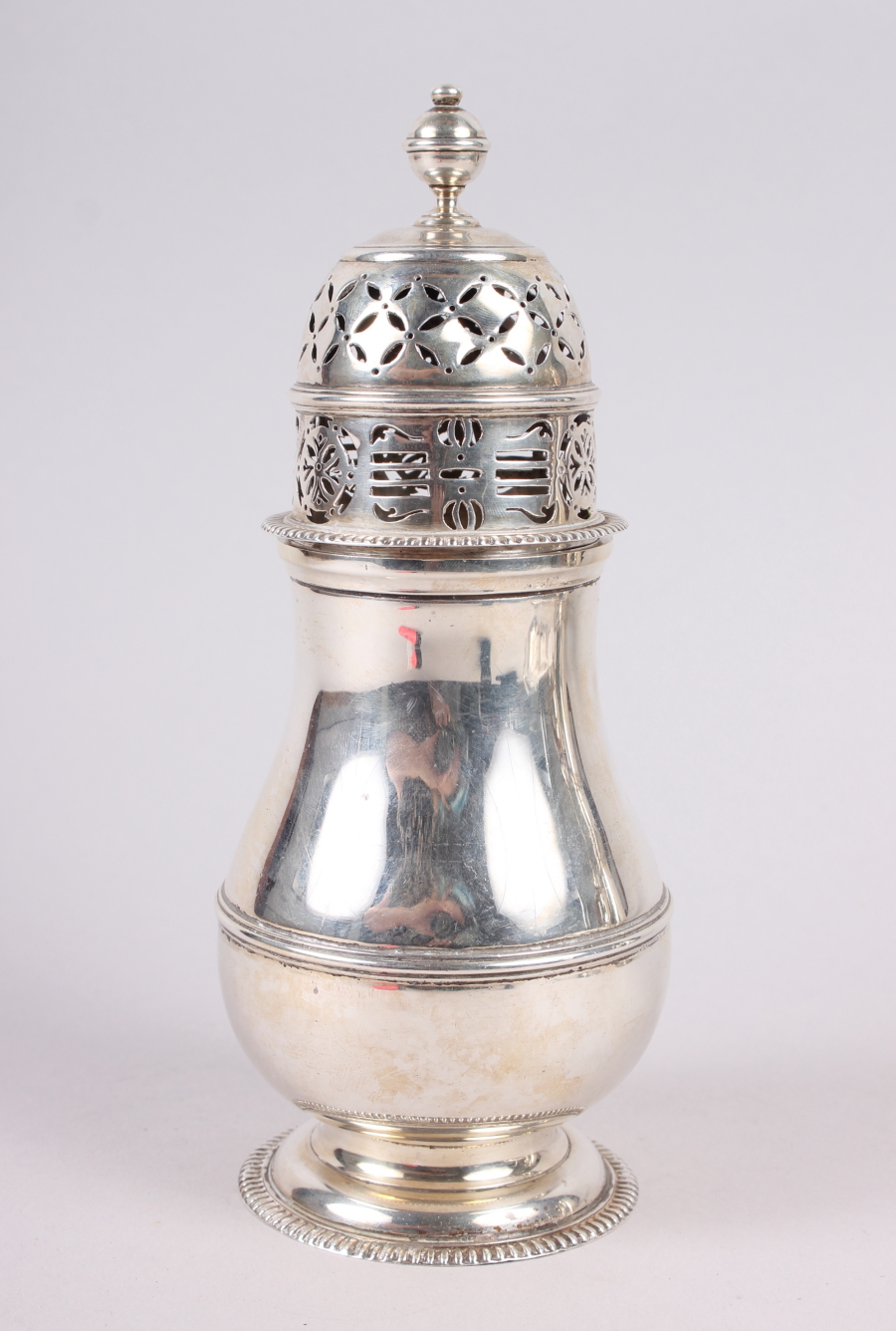 A Georgian design silver baluster sugar sifter, London 1907, 9.5oz troy approx
