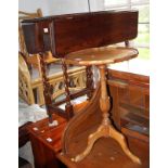 An oak drop-leaf dining table, on twist turned supports, 30" wide, an oak circular coffee table, 20"