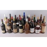 Twenty-four assorted old bottles of wine, in box