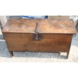 A 17th century oak plank chest with iron lock and staple hinges, 36" high (damages)