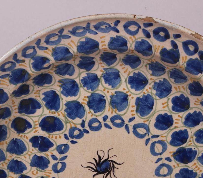 An 18th century Delft plate with all-over leaf and tendril design, 12" dia (rim chips) - Image 3 of 7