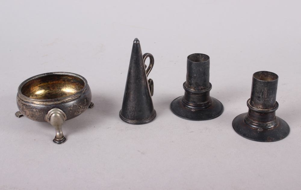 A Georgian silver candle snuffer, a pair of white metal candle sconces (maker's mark only) and a