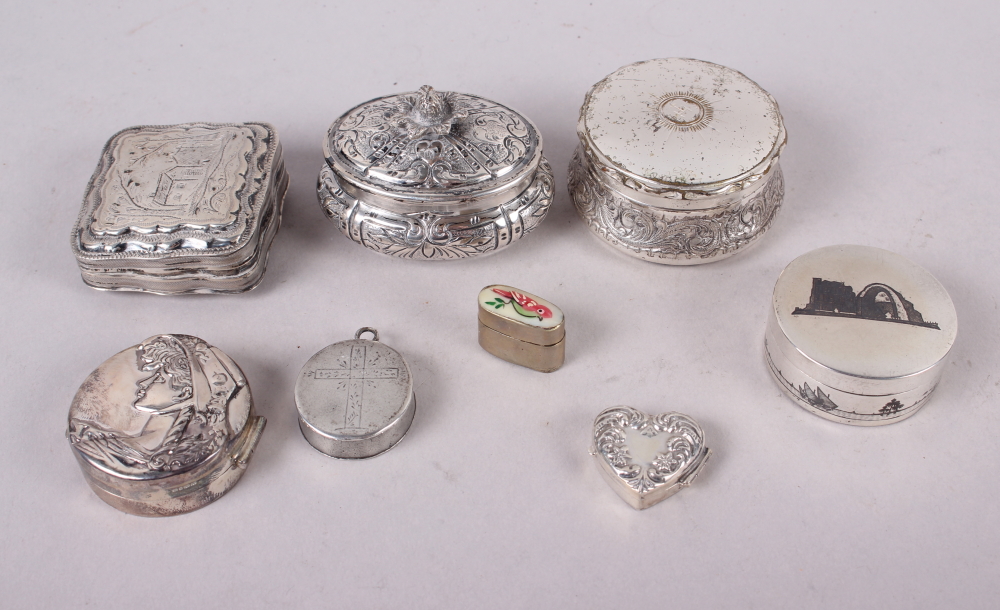 A modern circular silver trinket box, the lid embossed lady's head, a smaller heart-shaped trinket
