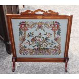 An Edwardian satinwood banded and inlaid mahogany framed firescreen, inset tapestry panel of two