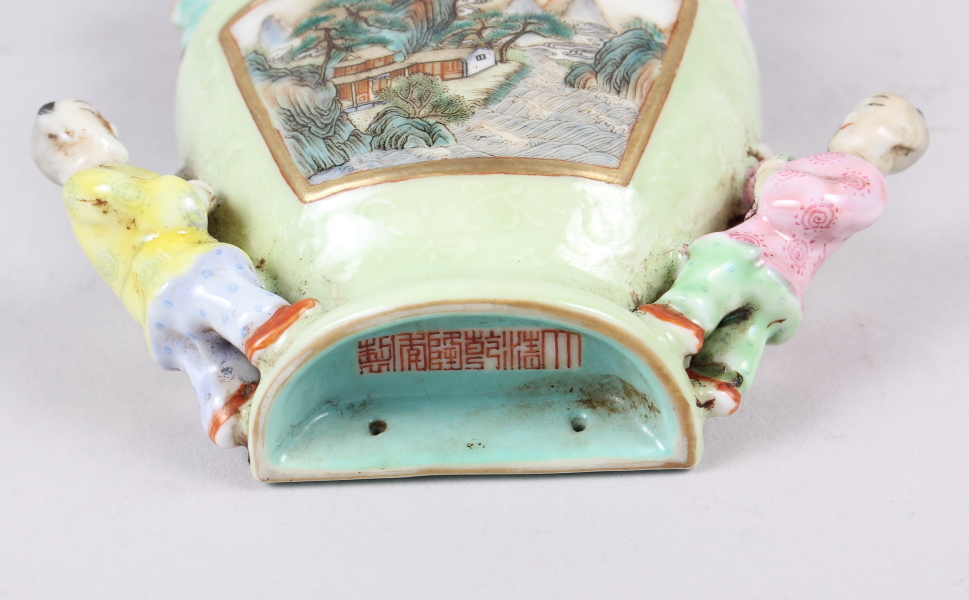 A Chinese polychrome decorated figure of a man holding a sword, a green glazed wall pocket with - Image 3 of 25