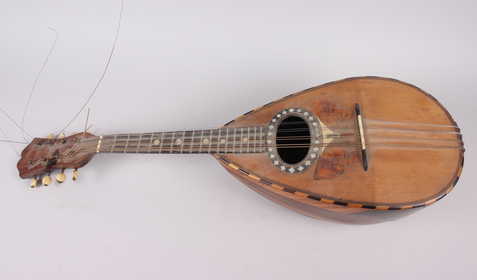 A 19th century Stridente rosewood mandolin, face decorated mother-of-pearl inlay and inlaid