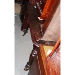 A 19th century mahogany extending dining table with centre leaf and winding handle, on turned