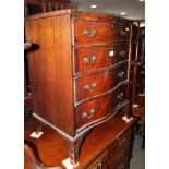 A George III design serpentine front chest of four drawers, 33" wide