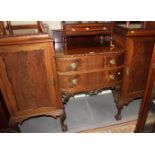 An Edwardian mahogany drop centre break bowfront sideboard, fitted cellar drawer, cupboards and