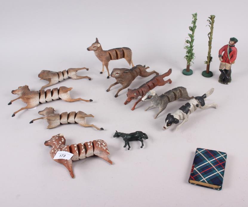 A collection of carved wooden articulated animals (damages)