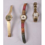 A lady's Longines wristwatch, on flexible yellow metal bracelet, and two other wristwatches