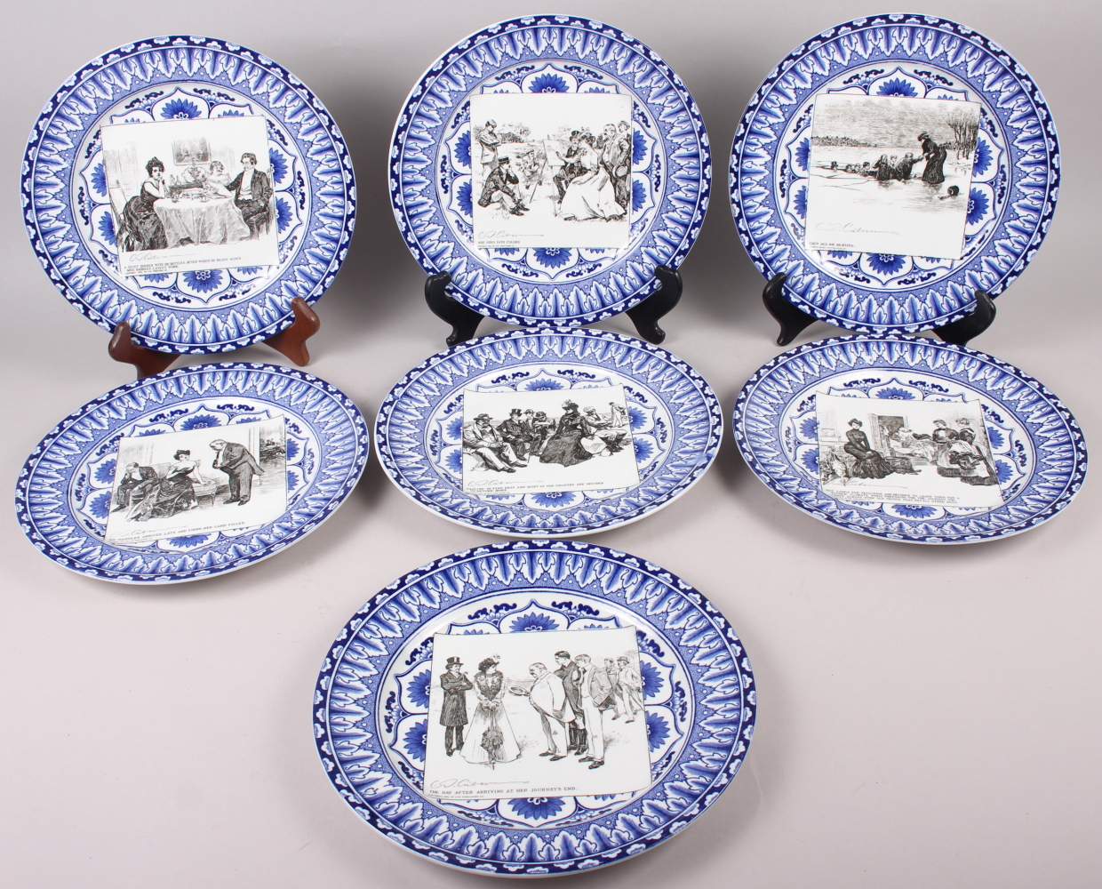 Seven Royal Doulton blue and white decorated "Gibson Girls" cabinet plates, 10 1/2" dia