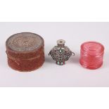 A Peking glass ring box, a circular cinnabar lacquer box and Chinese white metal snuff bottle,