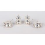 Two silver mustard pots and a pair of silver pepper pots, 4.7oz troy approx
