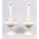 A pair of 19th century opaline glass vases with floral decoration